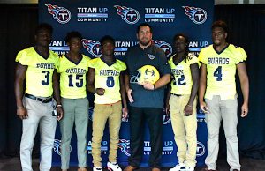 Josh Corey, center, poses with key Hillsboro High School football players who attend the 2nd Annual Tennessee Titans High  School Media Day. Corey is the Outreach Coordinator for the Tennessee Titans