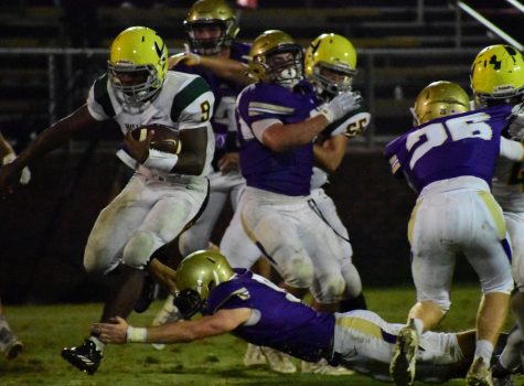 Hillsboros Jacob Frazier breaks through CPAs defensive line as is headed for the end zone for one of his 2 TDs in the solid win (30-28) against CPA.