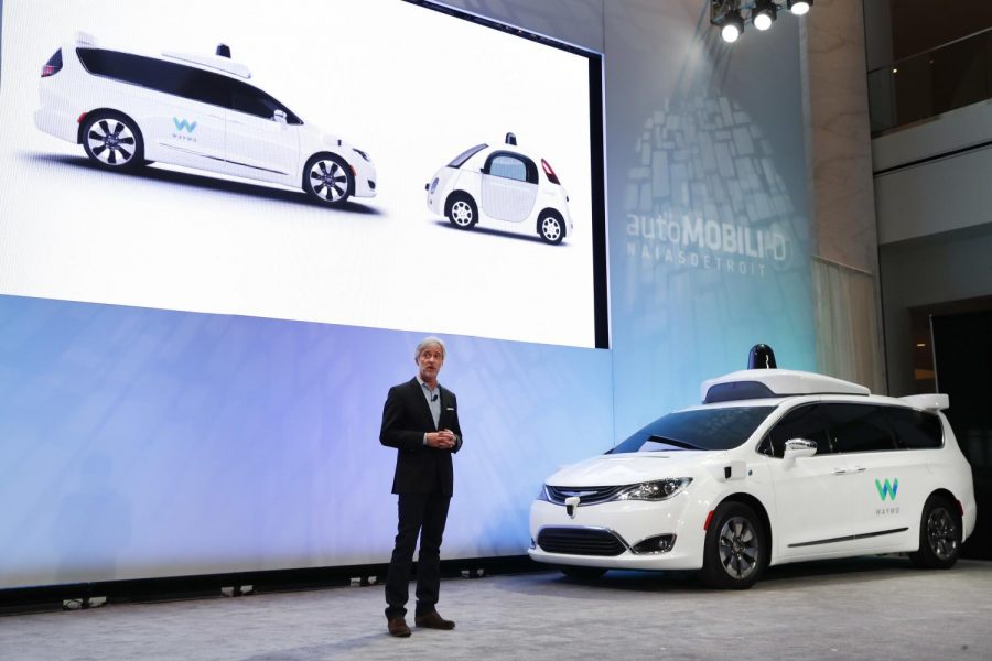 FILE - In this Jan. 8, 2017, file photo John Krafcik, CEO of Waymo Inc., the autonomous vehicle company created by Googles parent company, introduces a Chrysler Pacifica hybrid outfitted with Waymos own suite of sensors and radar at the North American International Auto Show in Detroit. California regulators have taken an important step to clear the road for everyday people to get self-driving cars. The states Department of Motor Vehicles on Wednesday, Oct. 11, 2017, published proposed rules that would govern the technology within California, where manufacturers have been testing hundreds of prototypes on roads and highways. 