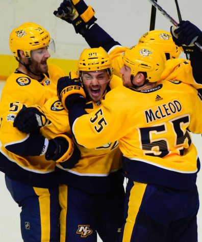 Nashville Predators surround 19 years old Samuel Girard (94) as he celebrates his first NHL goal in his second game. Girards goal came in front of his parents who flew in from Quebec to see him play against the Dallas Stars, Thursday, Oct. 12, 2017, in Nashville, Tenn. (SportsNashville.net Photo/Mike Strasinger)