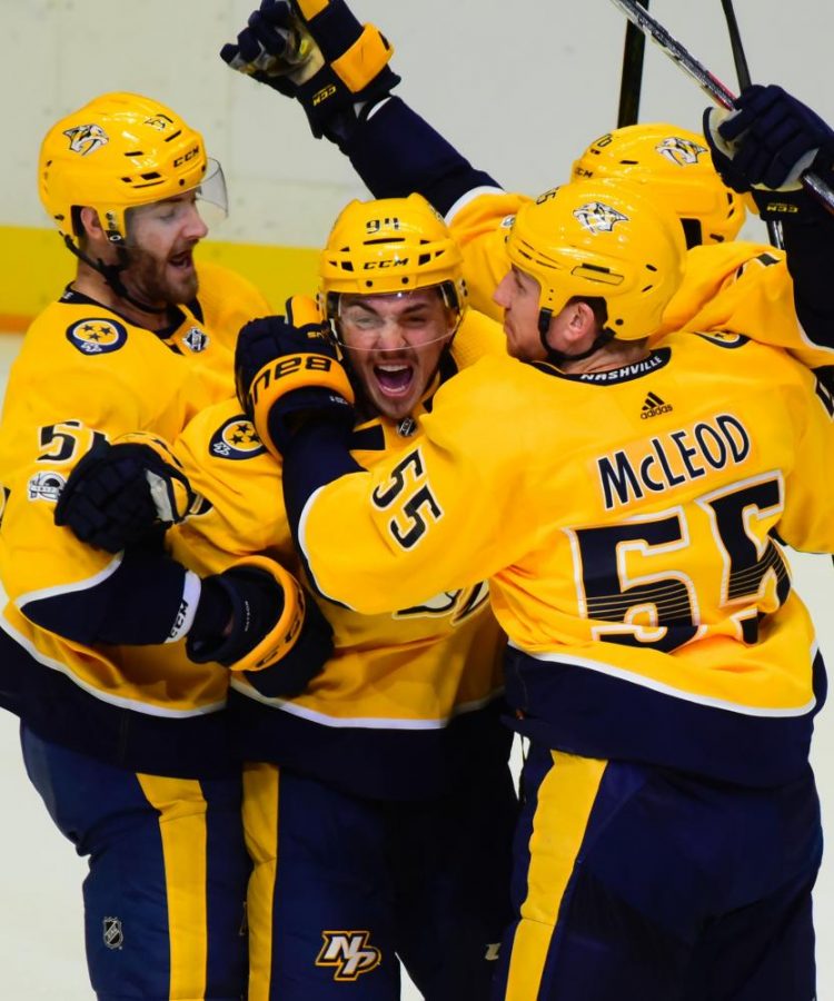 Nashville+Predators+surround+19+years+old+Samuel+Girard+%2894%29+as+he+celebrates+his+first+NHL+goal+in+his+second+game.+Girards+goal+came+in+front+of+his+parents+who+flew+in+from+Quebec+to+see+him+play+against+the+Dallas+Stars%2C+Thursday%2C+Oct.+12%2C+2017%2C+in+Nashville%2C+Tenn.+%28SportsNashville.net+Photo%2FMike+Strasinger%29