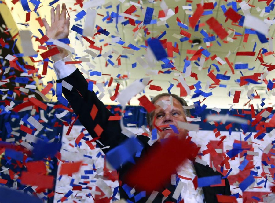 Democrat Doug Jones waves to supporters Tuesday, Dec. 12, 2017, in Birmingham, Ala. In a stunning victory aided by scandal, Jones won Alabamas special Senate election, beating back history, an embattled Republican opponent and President Donald Trump, who urgently endorsed GOP rebel Roy Moore despite a litany of sexual misconduct allegations. (AP Photo/John Bazemore)