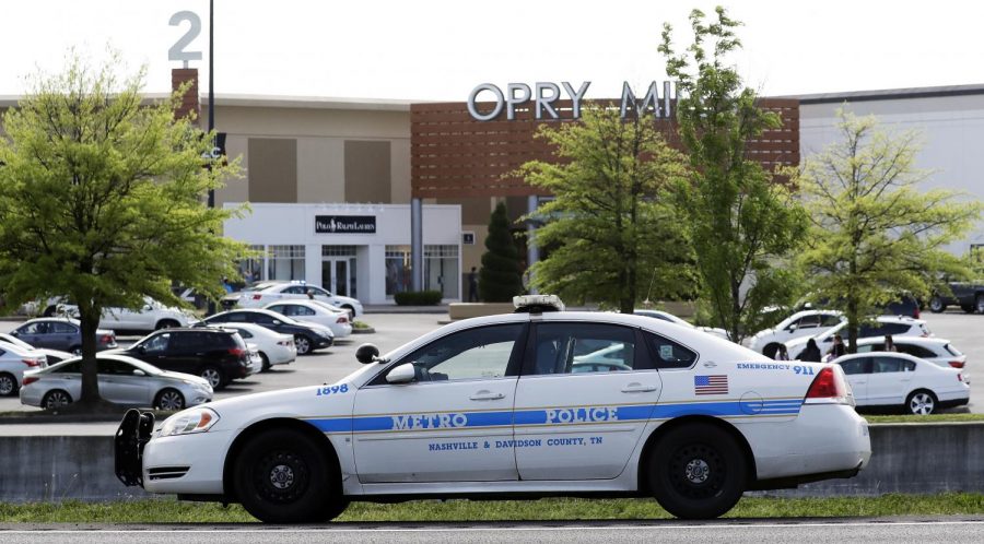 A police car sits outside Opry Mills mall Thursday, May 3, 2018, in Nashville, Tenn. Nashville police said a suspect was taken into custody after a person was shot inside the mall. The mall was evacuated after the gunfire was reported. One person was taken to a hospital and was reported to be in critical condition. (AP Photo/Mark Humphrey)