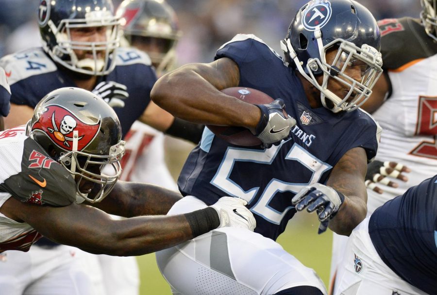 Tennessee Titans running back Derrick Henry (22) carries the ball past Tampa Bay Buccaneers defensive end Vinny Curry (97) in the first half of a preseason NFL football game Saturday, Aug. 18, 2018, in Nashville, Tenn. (AP Photo/Mark Zaleski))