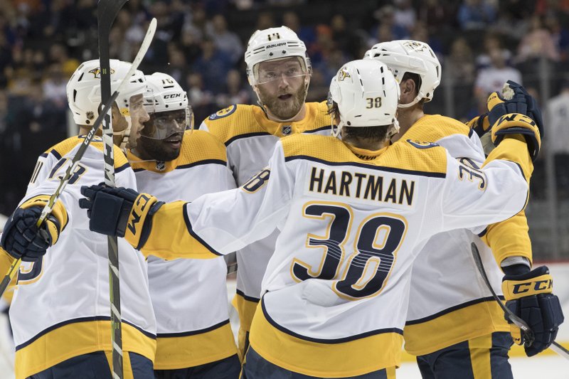 Nashville+Predators+celebrate+after+goal+against+the+New+York+Islanders+goaltender+Thomas+Greiss+%281%29+during+the+first+period+of+an+NHL+hockey+game%2C+Saturday%2C+Oct.+6%2C+2018%2C+in+New+York.+%28AP+Photo%2FMary+Altaffer%29