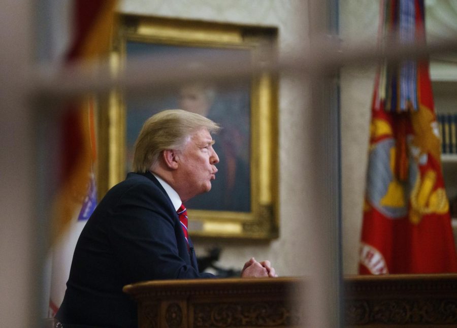 FILE- In this Tuesday, Jan. 8, 2019, file photo seen from a window outside the Oval Office, President Donald Trump gives a prime-time address about border security at the White House in Washington. With the standoff over paying for his long-promised border wall dragging on, the president’s Oval Office address and visit to the Texas border over the past week failed to break the logjam and left aides and allies fearful that the president has misjudged Democratic resolve and is running out of negotiating options. (AP Photo/Carolyn Kaster, File