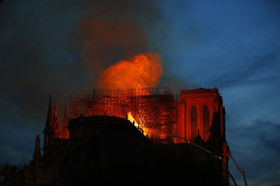 Firefighters use hoses as Notre Dame cathedral burns in Paris, Monday, April 15, 2019. A catastrophic fire engulfed the upper reaches of Paris soaring Notre Dame Cathedral as it was undergoing renovations Monday, threatening one of the greatest architectural treasures of the Western world as tourists and Parisians looked on aghast from the streets below. (AP Photo/Francois Mori)