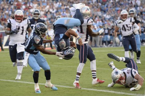 Tennessee Titans quarterback Marcus Mariota (8) flips into the end zone as he converts a 2-point conversion against the New England Patriots in the first half of a preseason NFL football game Saturday, Aug. 17, 2019, in Nashville, Tenn. (AP Photo/Mark Zaleski)