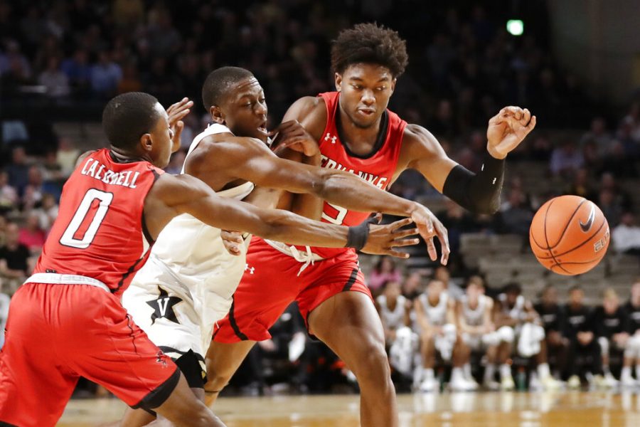 Vanderbilt guard Maxwell Evans, center, fights for the ball with Southeast Missouri States Alex Caldwell (0) and Nygal Russell, right, in the first half of an NCAA college basketball game Wednesday, Nov. 6, 2019, in Nashville, Tenn. (AP Photo/Mark Humphrey)