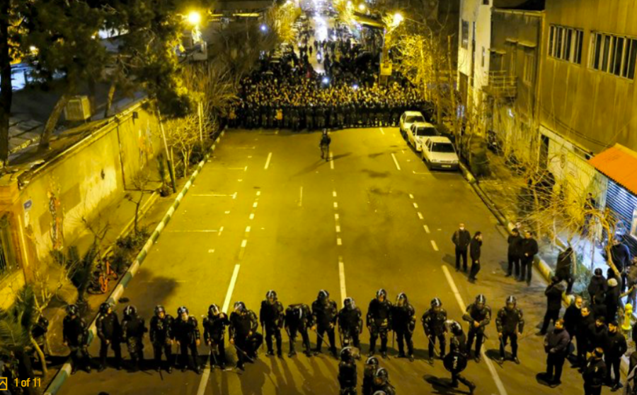 In this photograph taken Saturday, Jan. 11, 2020, Iranian police officers take position while protesters gather in front of Amir Kabir University in Tehran, Iran, to remember victims of a Ukrainian airplane shot down by an Iranian missile. Online videos purported to show Monday, Jan. 13, 2020, that Iranian security forces fired both live ammunition and tear gas to disperse demonstrators protesting against the Islamic Republics initial denial that it shot down a Ukrainian jetliner. (AP Photo)