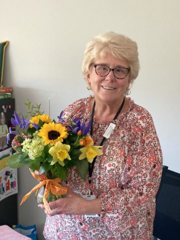 Nashville, TN, on March 29th Mrs. Richardson is presented with flowers on behalf of Coach Fitzgerald and the football team. 