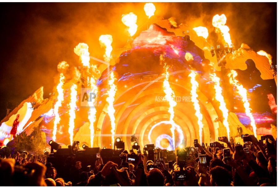 FILE - Travis Scott performs at Day 1 of the Astroworld Music Festival at NRG Park on Friday, Nov. 5, 2021, in Houston. Concertgoers described mounting anticipation for the headline rapper that led people to push toward the stage. (Photo by Amy Harris/Invision/AP, File)