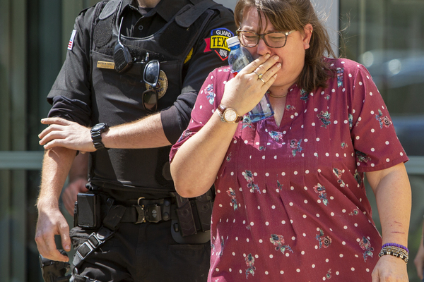 A woman cries as she leave the Uvalde Civic Center following a shooting earlier in the day at Robb Elementary School, Tuesday, May 24, 2022, in Uvalde, Texas. (William Luther/The San Antonio Express-News via AP)