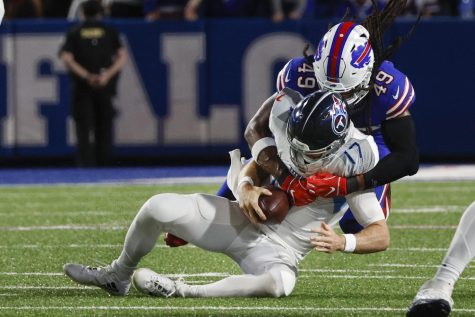 Buffalo Bills Tremaine Edmunds (49) sacks Tennessee Titans Ryan Tannehill (17) during the first half of an NFL football game Monday, Sept. 19, 2022, in Orchard Park, N.Y. (AP Photo/Jeffrey T. Barnes)