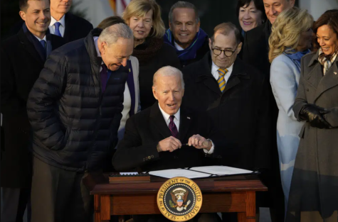 President Joe Biden signs the Respect for Marriage Act, Tuesday, Dec. 13, 2022, on the South Lawn of the White House in Washington.
