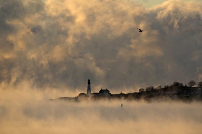 Lighthouse seen through the smoke