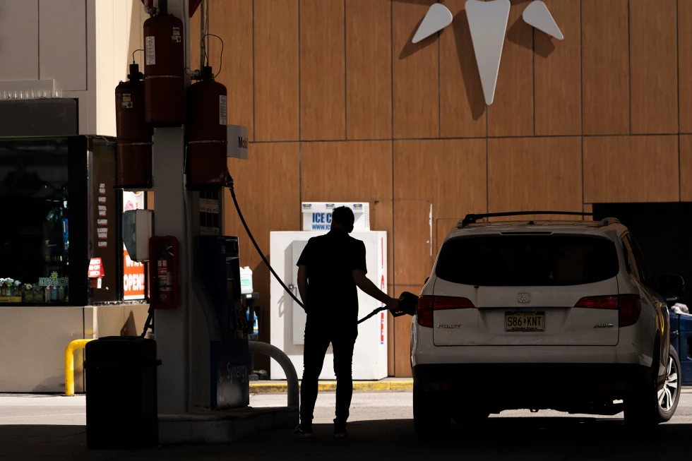 A person gets gas at a station March 10, 2026, in New York. (AP Photo/Yuki Iwamura, File)